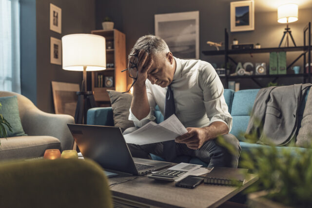 Small business owner reviewing a contract to identify legal risks and enforceability issues