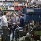 Startup owner reviewing an equipment leasing contract for business growth