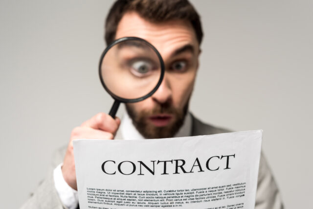 Hidden limitation of liability clause creating financial risk in a business contract