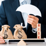 Business owner separating business debt from personal risk with records and contracts