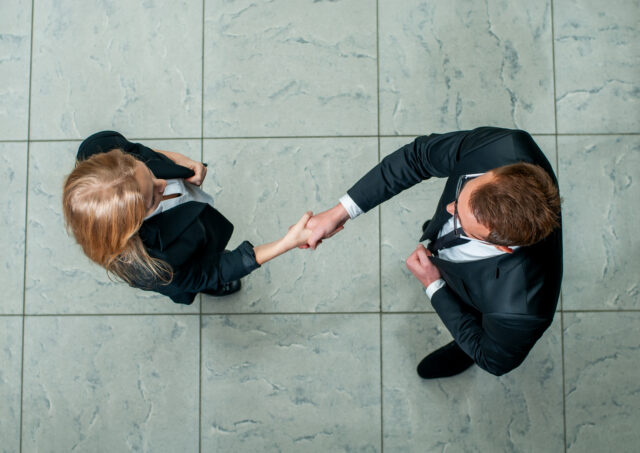 Business partners planning a partner buyout agreement and ownership separation